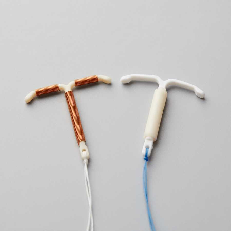 Two IUD devices side by side neutral background